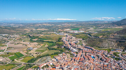 Obraz premium Aerial photo from drone to city of Loja and Church of the Incarnation with Moorish Alcazaba and Gorda Peak .Loja ,Granada, Andalusia, Spain, Europe (Series)