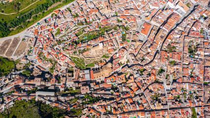 Fototapeta premium Aerial photo from drone to city of Loja and Church of the Incarnation with Moorish Alcazaba and Gorda Peak .Loja ,Granada, Andalusia, Spain, Europe (Series)