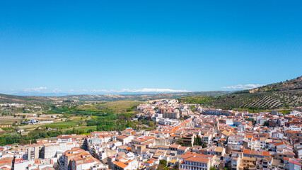 Obraz premium Aerial photo from drone to city of Loja and Church of the Incarnation with Moorish Alcazaba and Gorda Peak .Loja ,Granada, Andalusia, Spain, Europe (Series)