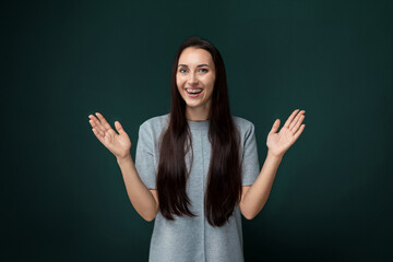 Woman With Long Hair Standing in Front of Green Background
