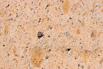 surface of yellow armenian tuff wall tile