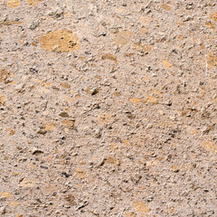 surface of brown armenian tuff wall tile close up