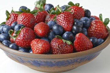 Obraz premium Fresh mixed berries including strawberries, blueberries, and raspberries in a bowl, vibrant and healthy, perfect for nutritious snacking and culinary delight