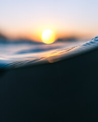 Macro shot of orange sunset half underwater