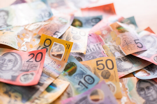 Australian notes in a messy pile for a background