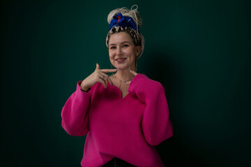 Woman in Pink Sweater Posing for Picture