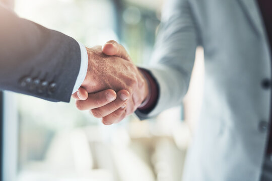 Partnership, handshake and business people in office for deal, welcome or onboarding for b2b collaboration. Meeting, teamwork and shaking hands for agreement, consulting or introduction with trust