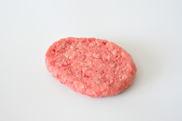 a hamburger cutlet made in a raw meat on white background