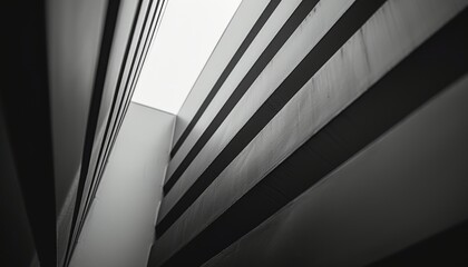 Obraz premium Abstract view of a modern building with geometric lines and light.