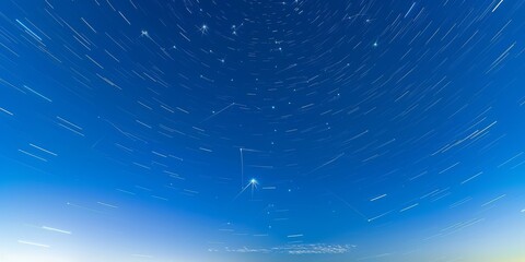 Fototapeta premium Background of stars tracing circular trails against the night sky, perfect for astronomical and night photography enthusiasts.