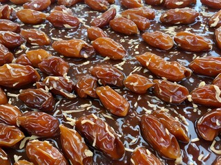 dates close up. date palm background. Date palm on a traditional craftsman market.Horizontal image.