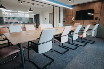 This image showcases a contemporary business office meeting room with elegant chairs, a large...