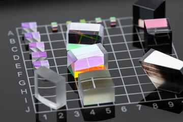 Set of optical crystals made of crown glass on black coordinate surface