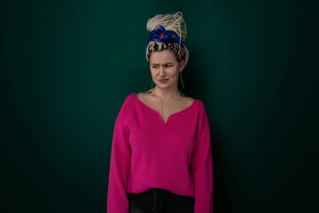 Woman Wearing Pink Sweater With Blue Bow on Her Head