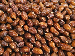 dates close up. date palm background. Date palm on a traditional craftsman market.Horizontal image.