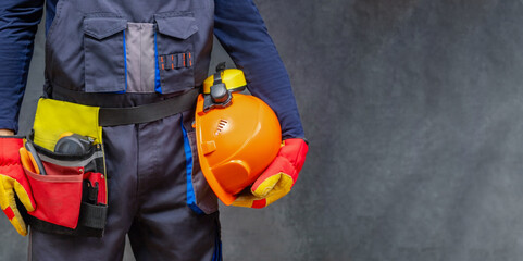Builder in personal protective equipment. Panoramic banner with copy space.
