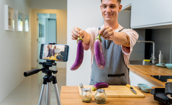 The chef is broadcasting live from workshop how to prepare a grilled eggplants with garlic