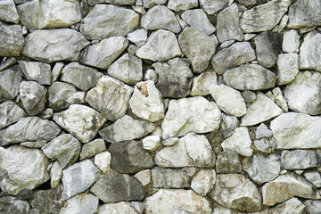 Marble blocks are stacked together to form a decorative wall.