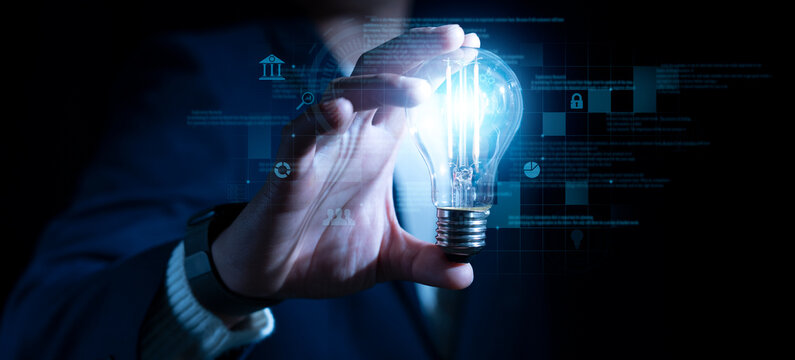 success businessman hold light bulb for good idea.brainstorming creative. Idea innovation and inspiration concept creativity with bulbs that shine, success moment and get the best idea to pass problem