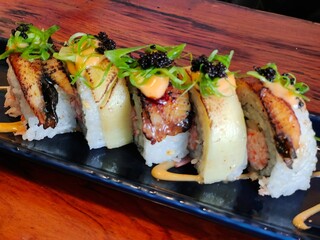 A close picture of a plate of fresh and delicious sushi