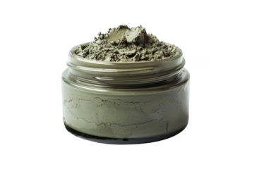 Glass jar filled with green clay mask for skincare, isolated on white background. Natural beauty product for healthy and radiant skin.