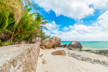 World famous Anse Source d'Argent beach under a cloudy sky