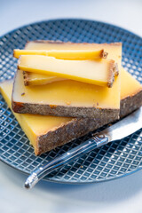 French cheese Comte, varieties unpasteurised ed milk Prestige, fruity flavoured Fruite and Vieille Reserve close up