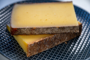 French cheese Comte, varieties unpasteurised ed milk Prestige, fruity flavoured Fruite and Vieille Reserve close up