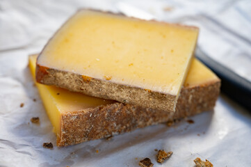 French cheese Comte, varieties unpasteurised ed milk Prestige, fruity flavoured Fruite and Vieille Reserve close up