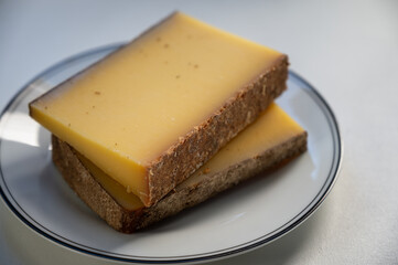 French cheese Comte, varieties unpasteurised ed milk Prestige, fruity flavoured Fruite and Vieille Reserve close up