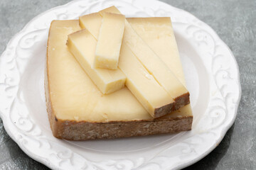 French cheese Comte, varieties unpasteurised ed milk Prestige, fruity flavoured Fruite and Vieille Reserve close up