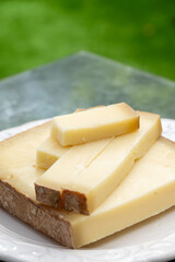 French cheese Comte, varieties unpasteurised ed milk Prestige, fruity flavoured Fruite and Vieille Reserve close up