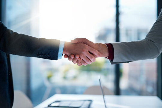 Deal, handshake and business people in office for agreement, welcome or onboarding for b2b collaboration. Partnership, teamwork and shaking hands for meeting, consulting or introduction with trust