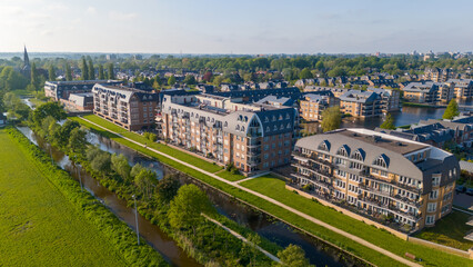 Aerial drone photo of a residential neighbourhood with luxury apartment buildings in Voorschoten, the Netherlands.