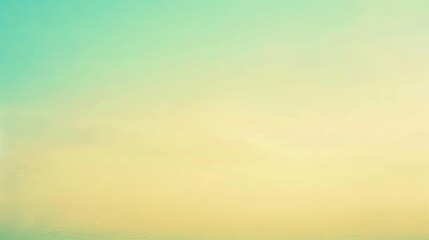 A serene beach landscape with a calm sea under a clear sky with a gradient of yellows and greens, ideal for relaxation.