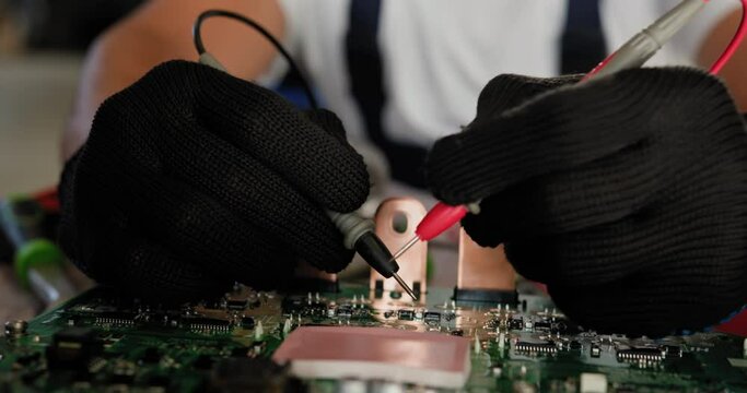Close-up of a technician using probes to inspect an Electronic Control Unit (ECU). The image captures precision, focus, and technical expertise in electronics and repair. Inspecting Control Unit