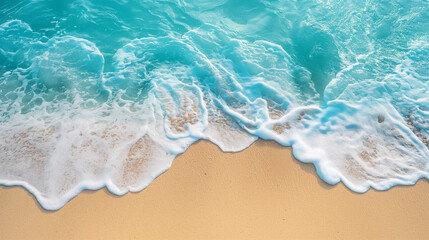 Clear blue waves roll onto a sandy beach, capturing the essence of a peaceful and sunny tropical paradise.