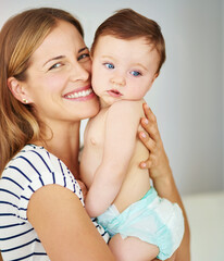 Smile, portrait and mother holding baby in diaper at home for safety, love and protection. Happy,...