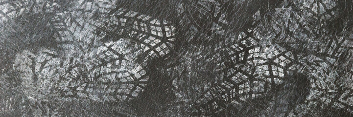 Panoramic image. Construction workers' shoe prints on black Polyethylene Vapor Barrier