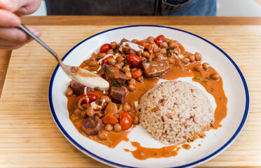 Chef at the kitchen preparing massaman curry with sweet potato and many spices