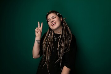 Woman With Dreadlocks Making a Peace Sign