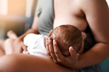 Breastfeeding, baby and young mother in bedroom for growth development, nutrition or digestive health. Care, infant and woman with newborn child for natural milk, wellness or bonding in home