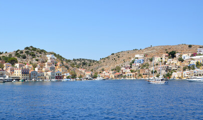 a city is located on the water with the blue sea Greece copy space 