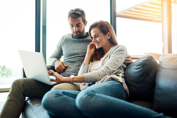 Obraz premium Home, couple and laptop for finance, conversation and planning for budget, payment and research for movie, series or film. Joy, apartment and man with woman, computer and investment in living room