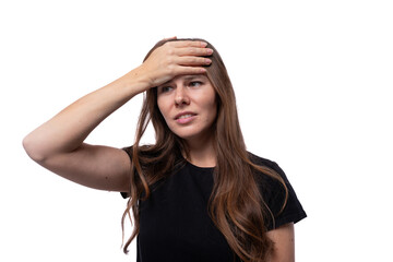 Fototapeta premium Puzzled young woman with straight brown hair is excited and worried