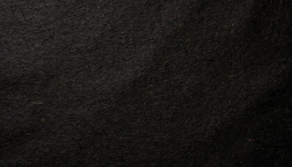 Dark, dusty, grainy, rough, earthy handmade black paper texture with visible fibers, for minimalistic art or backgrounds.