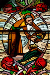 A stained glass of Saint Vincent de Paul. Vitrail de Saint Vincent de Paul. Annecy - France