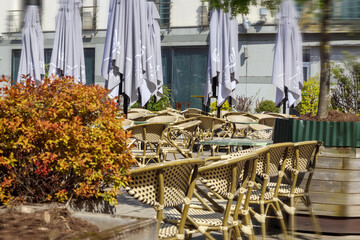 
Prepared outdoor cafe with tables and umbrellas
