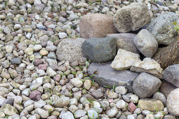 
Big and small stone pebbles on a dry beach