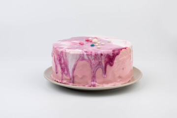 Modern pink cream cake on light backround
